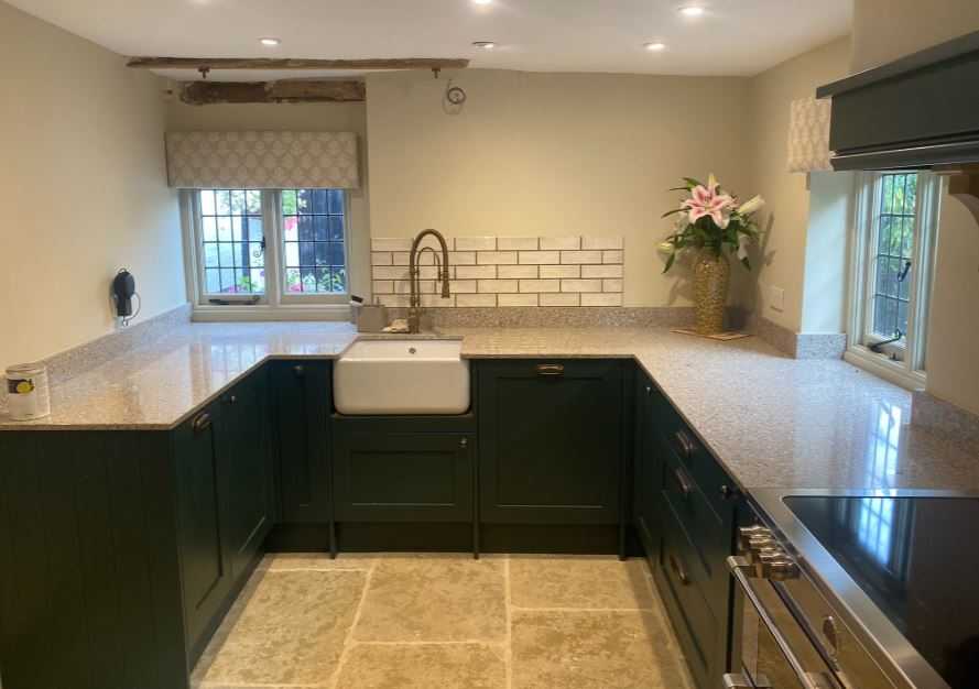Charming Country-Chic Kitchen with Dark Green Cabinetry and Contemporary Elegance