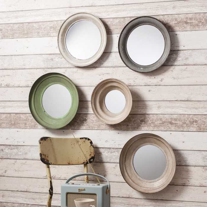 Neutral coloured round mirrors in a collection