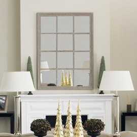 Cream Mirror on a fireplace with cream vases